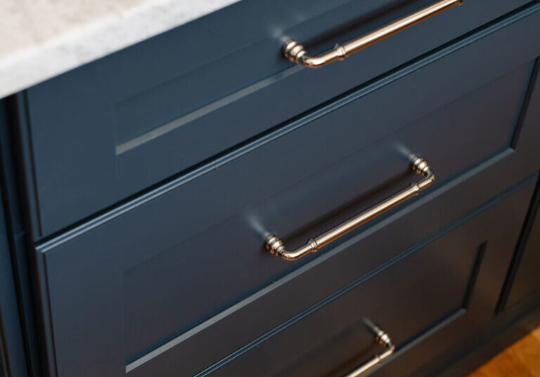 Blue and brushed Nickle cabinet details